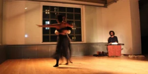 Detail shot: Baharak Abdolifard and Nima Nazarinia acting in theatre play, 2017